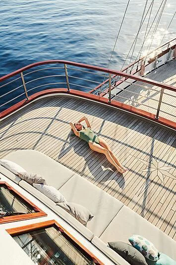 a person on a roof aboard CORSARIO Yacht for Charter