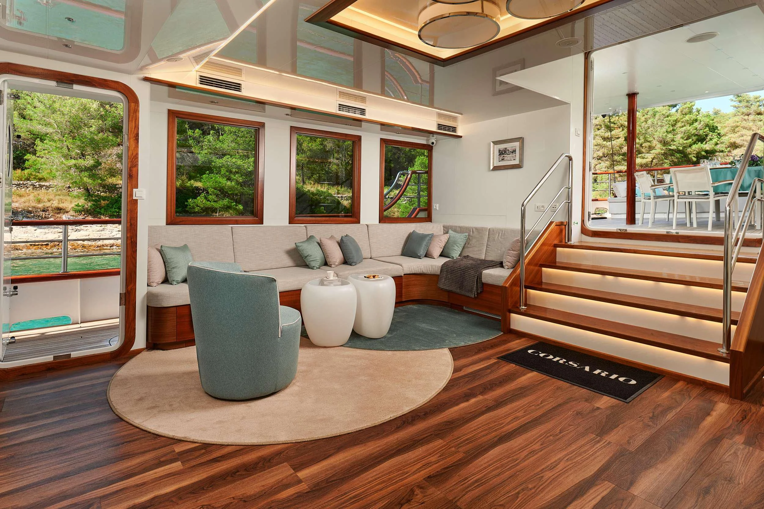 a living room with a large window aboard CORSARIO Yacht for Charter