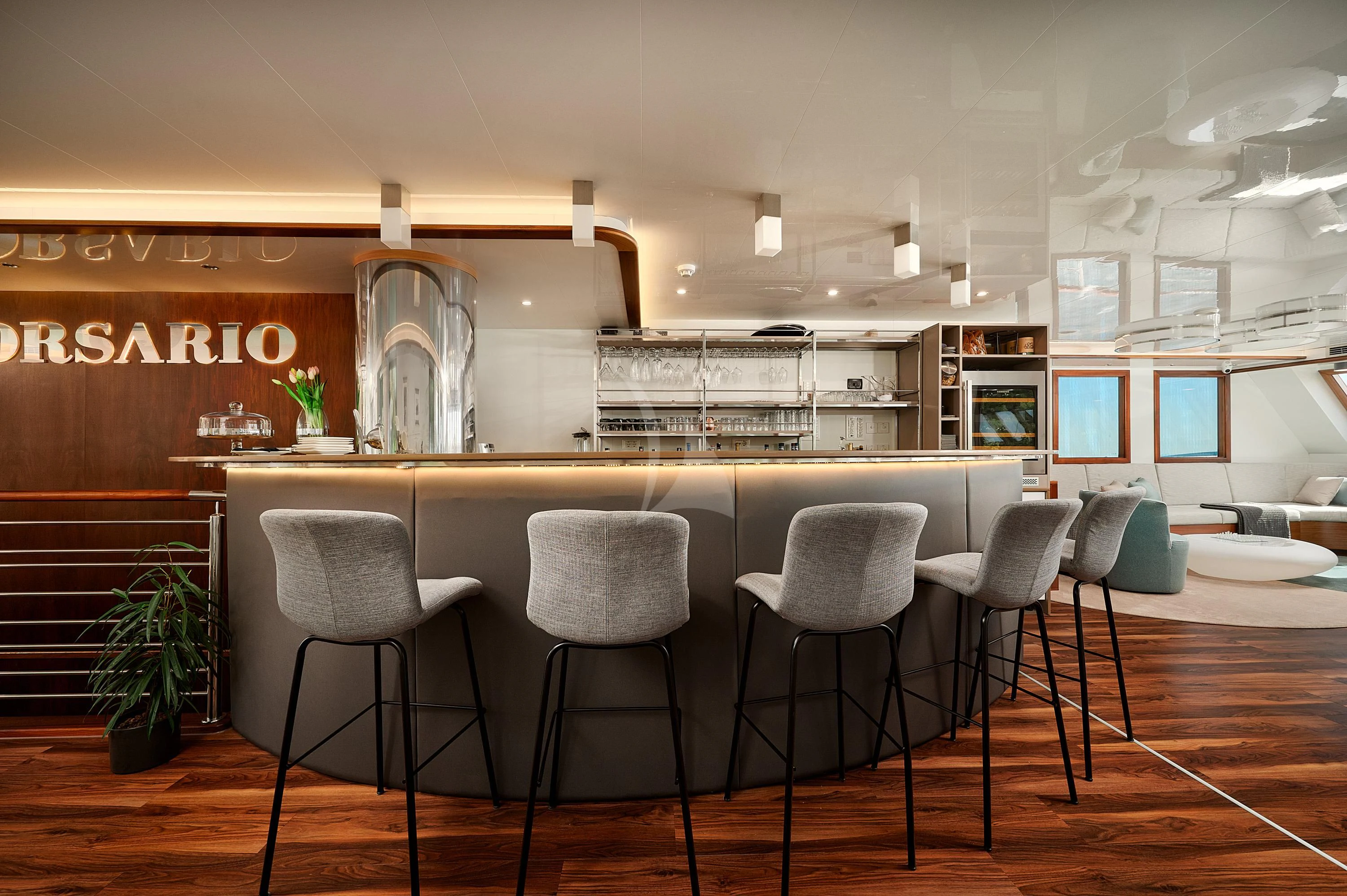 a room with chairs and tables aboard CORSARIO Yacht for Charter