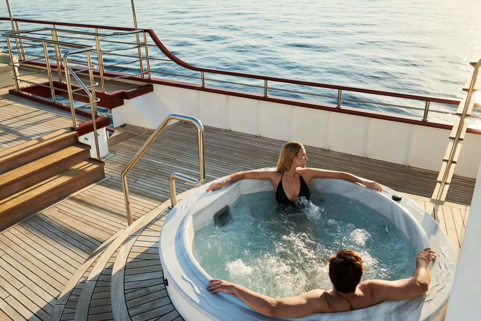 a couple of people in a pool aboard CORSARIO Yacht for Charter