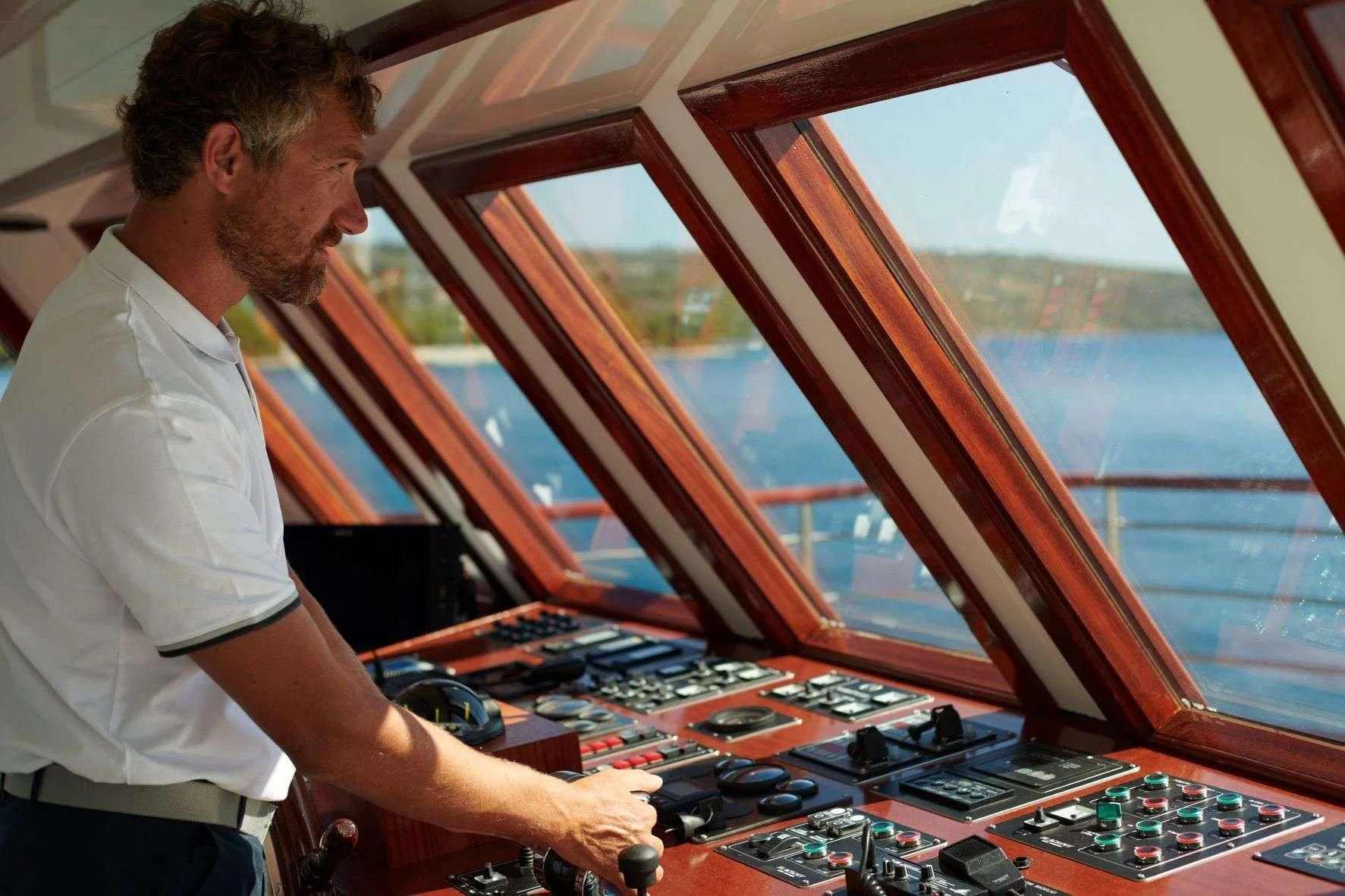 a man working on a computer aboard CORSARIO Yacht for Charter