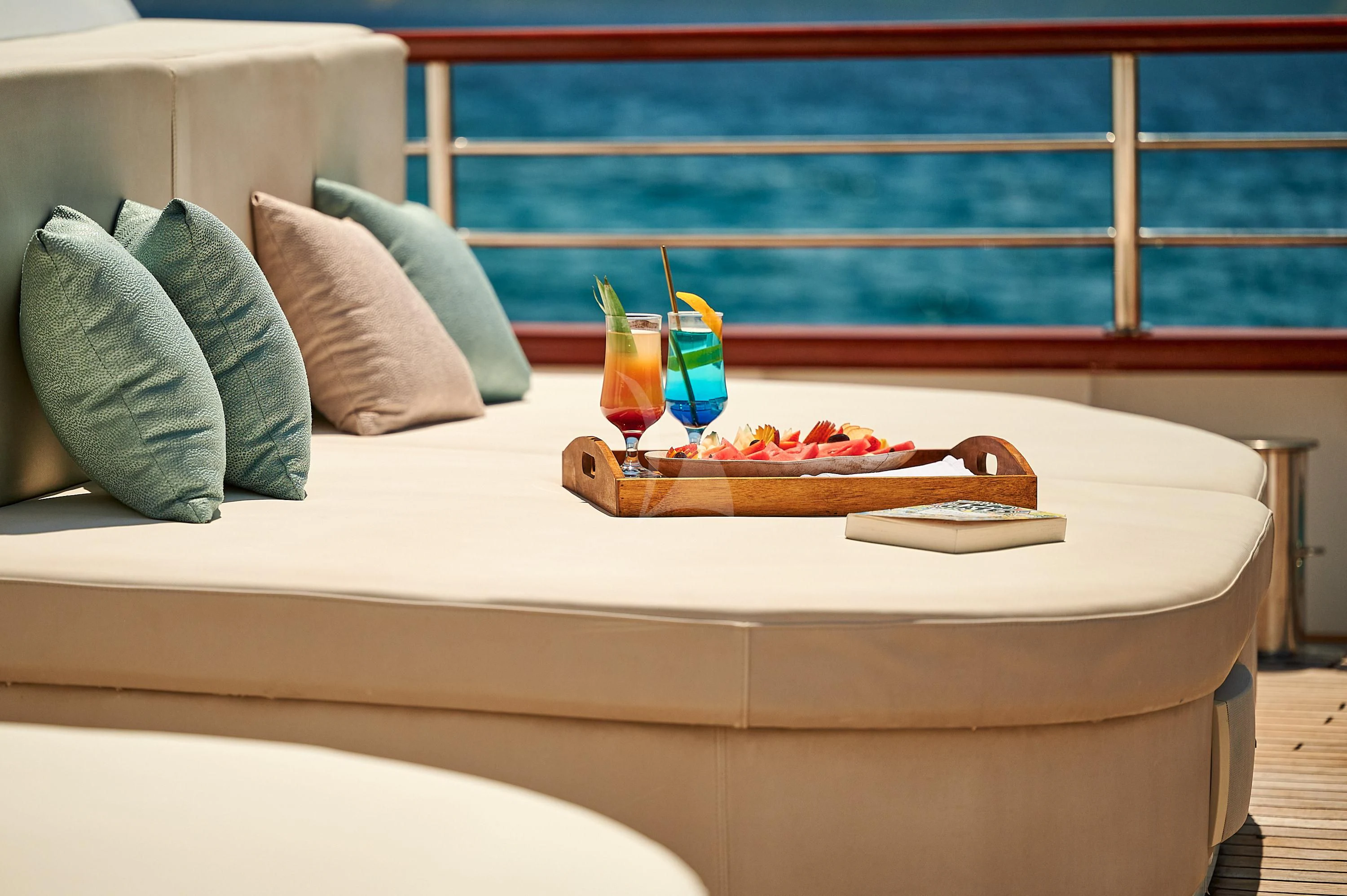 a bed with a tray of food aboard CORSARIO Yacht for Charter