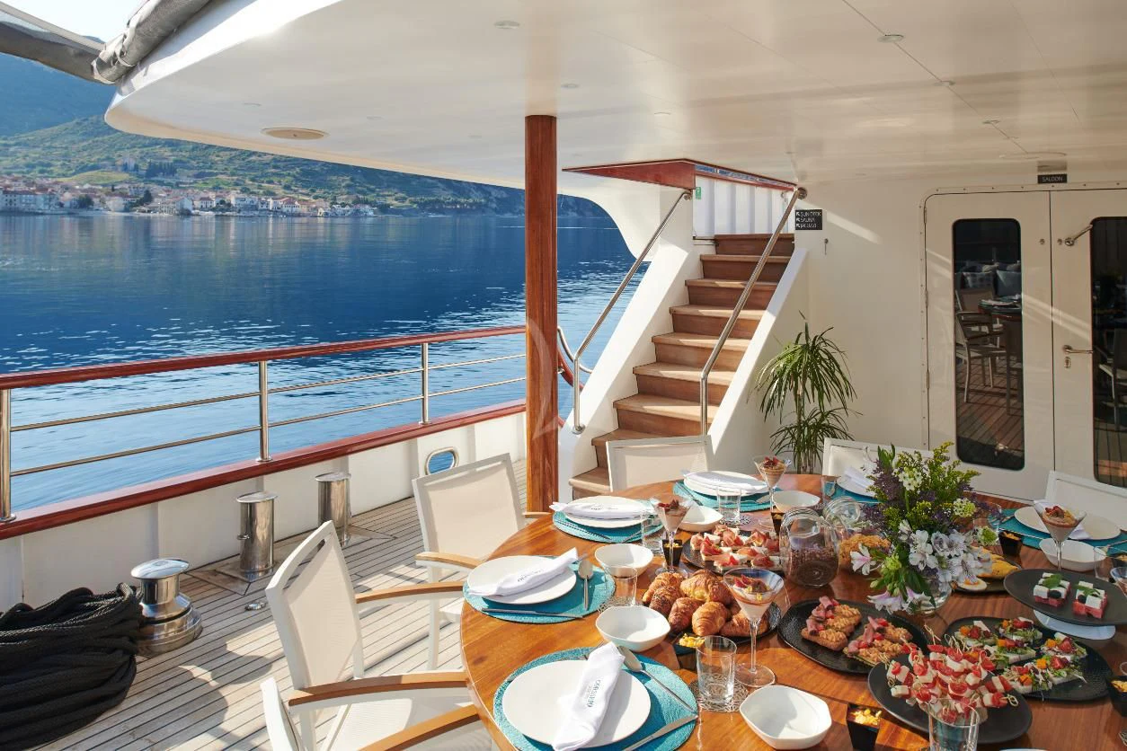 a table with food on it aboard CORSARIO Yacht for Charter