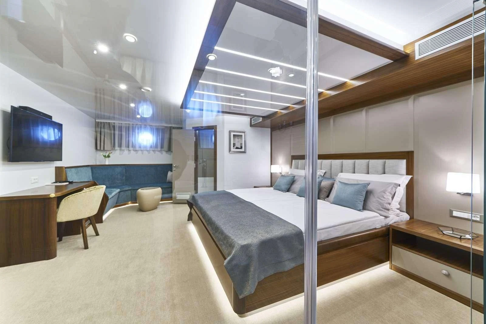 a large bedroom with a bed and a tv aboard CORSARIO Yacht for Charter