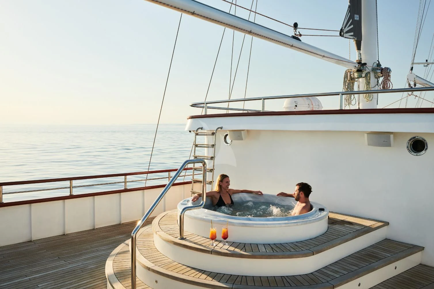 a couple of people on a boat aboard CORSARIO Yacht for Charter