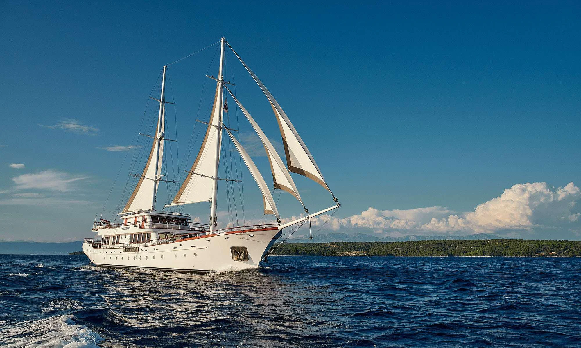 a white boat on the water aboard CORSARIO Yacht for Charter