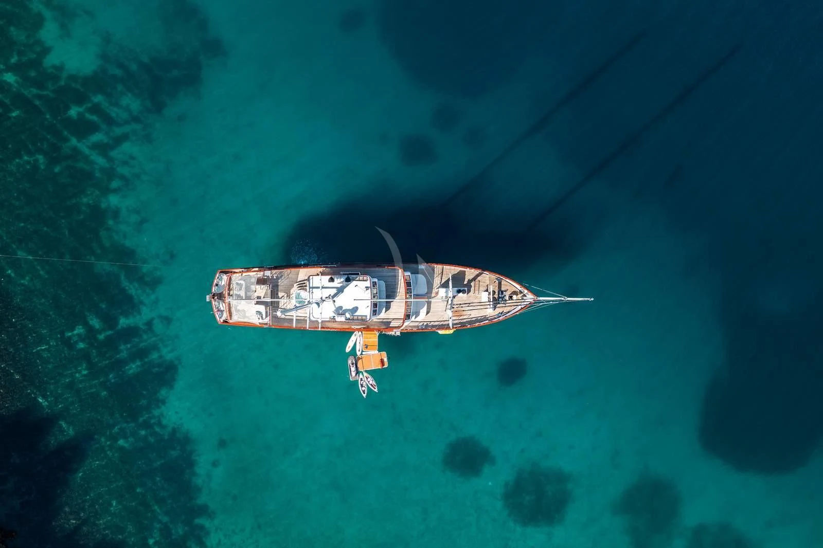 a helicopter flying over a planet aboard CORSARIO Yacht for Charter