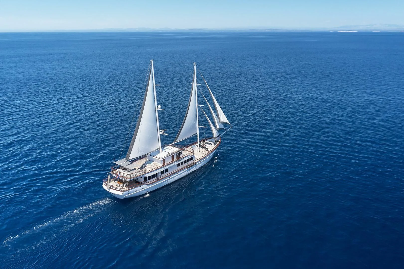 a boat sailing on the sea aboard CORSARIO Yacht for Charter