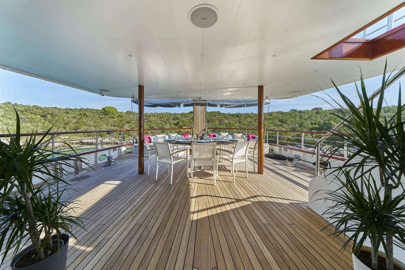 a deck with a deck and chairs aboard CORSARIO Yacht for Charter