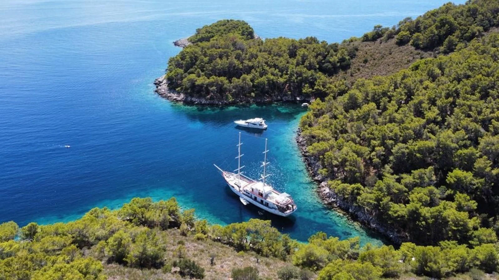 a boat sailing on the sea aboard CORSARIO Yacht for Charter