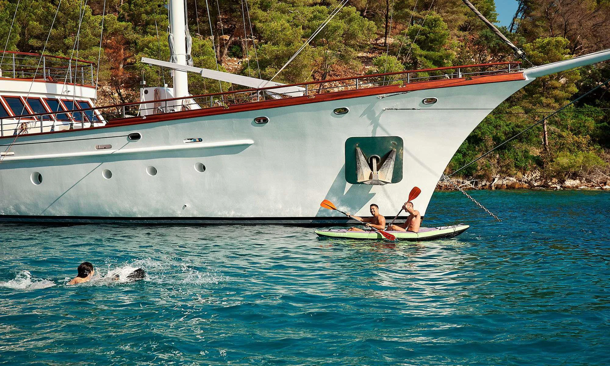 a boat with people in it aboard CORSARIO Yacht for Charter