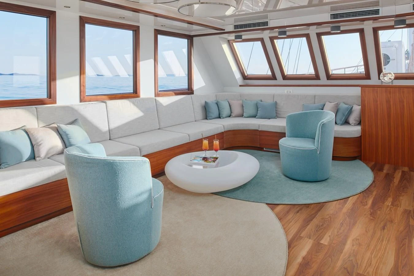 a living room with a couch and a table aboard CORSARIO Yacht for Charter