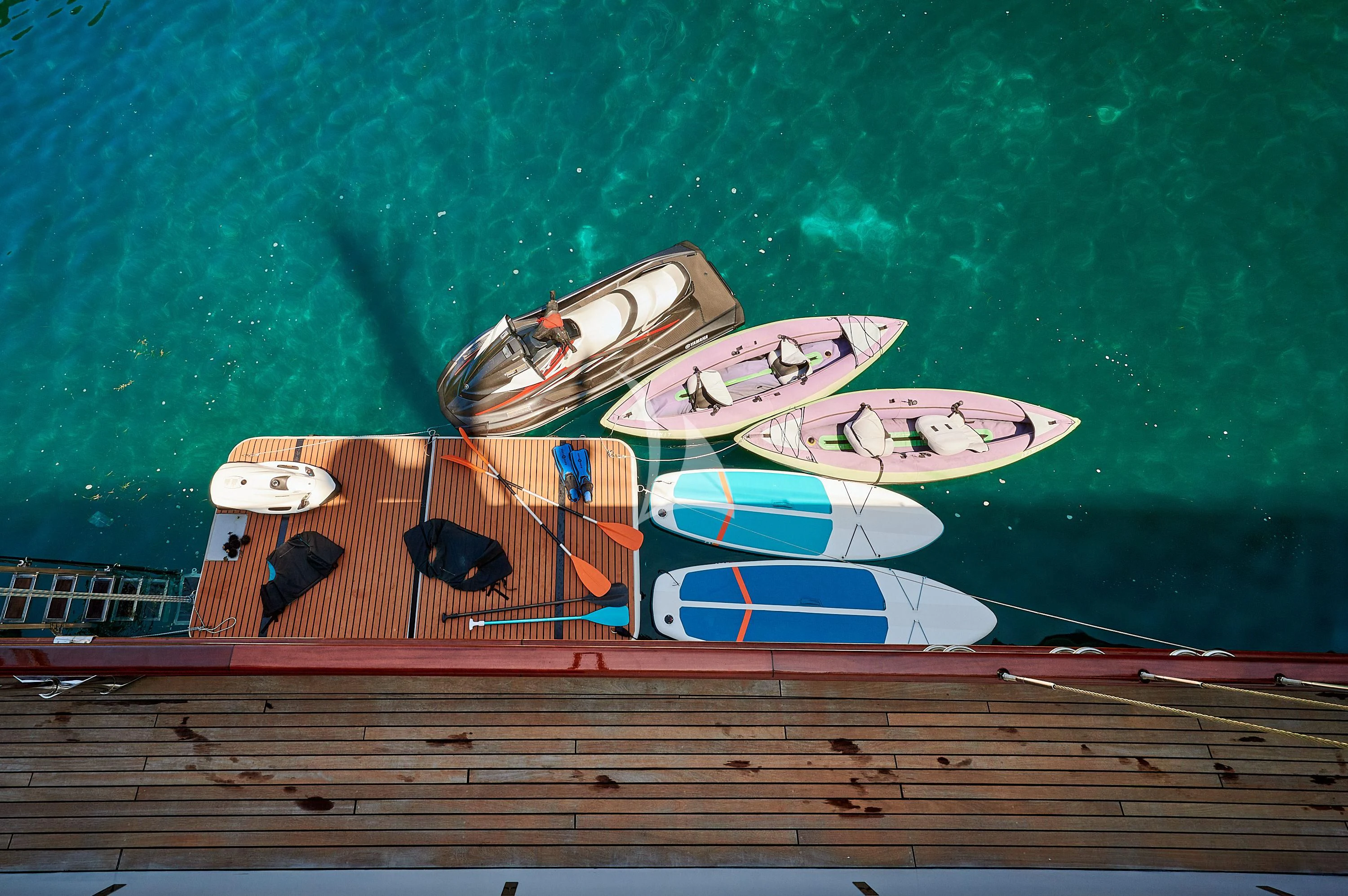 a row of boats on a dock aboard CORSARIO Yacht for Charter