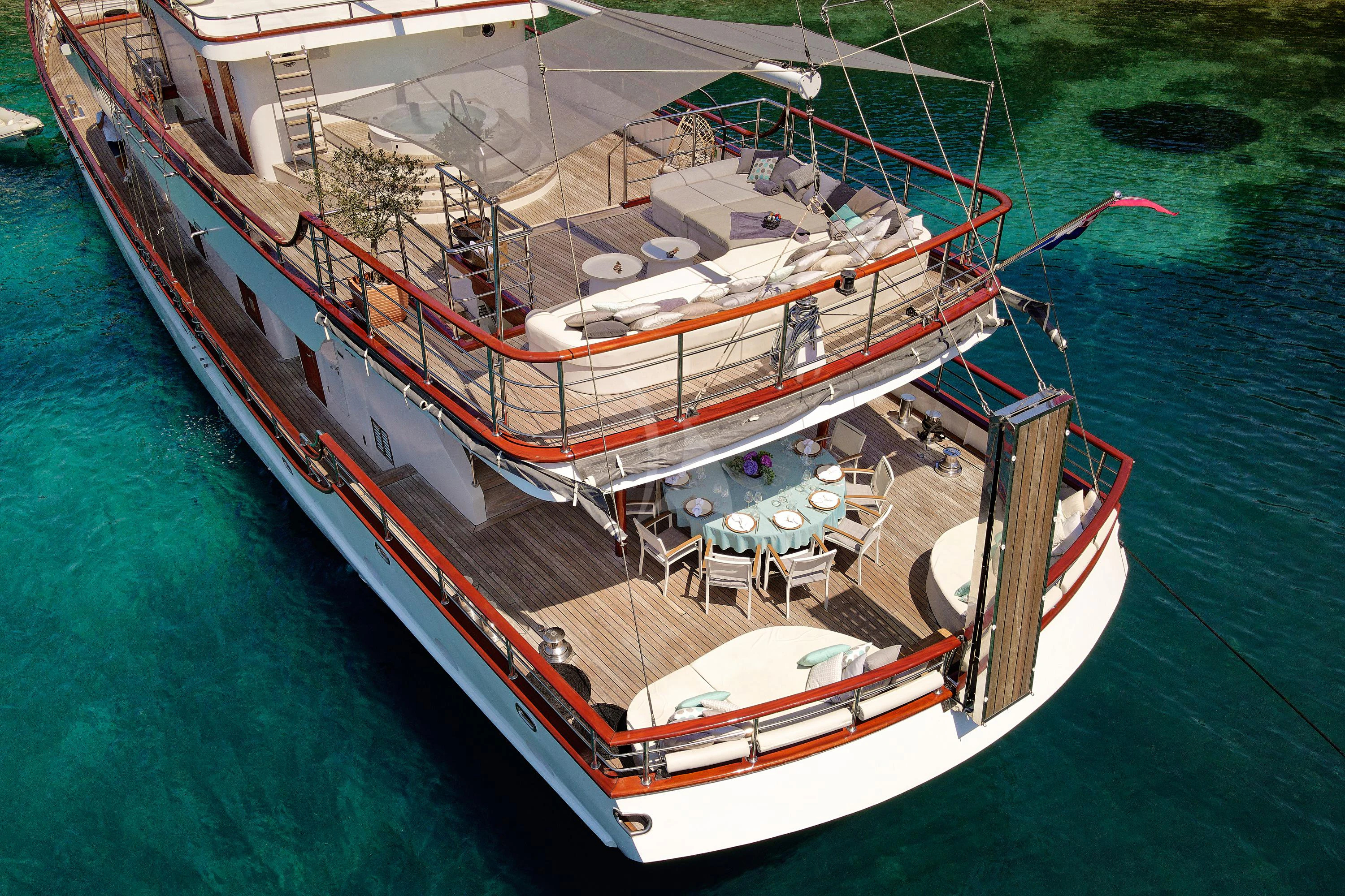 a large ship docked aboard CORSARIO Yacht for Charter