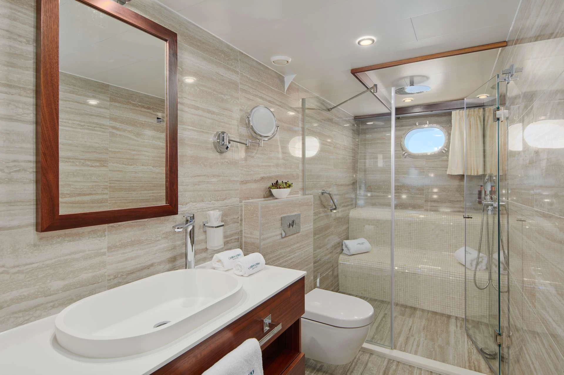 a bathroom with a glass shower aboard CORSARIO Yacht for Charter