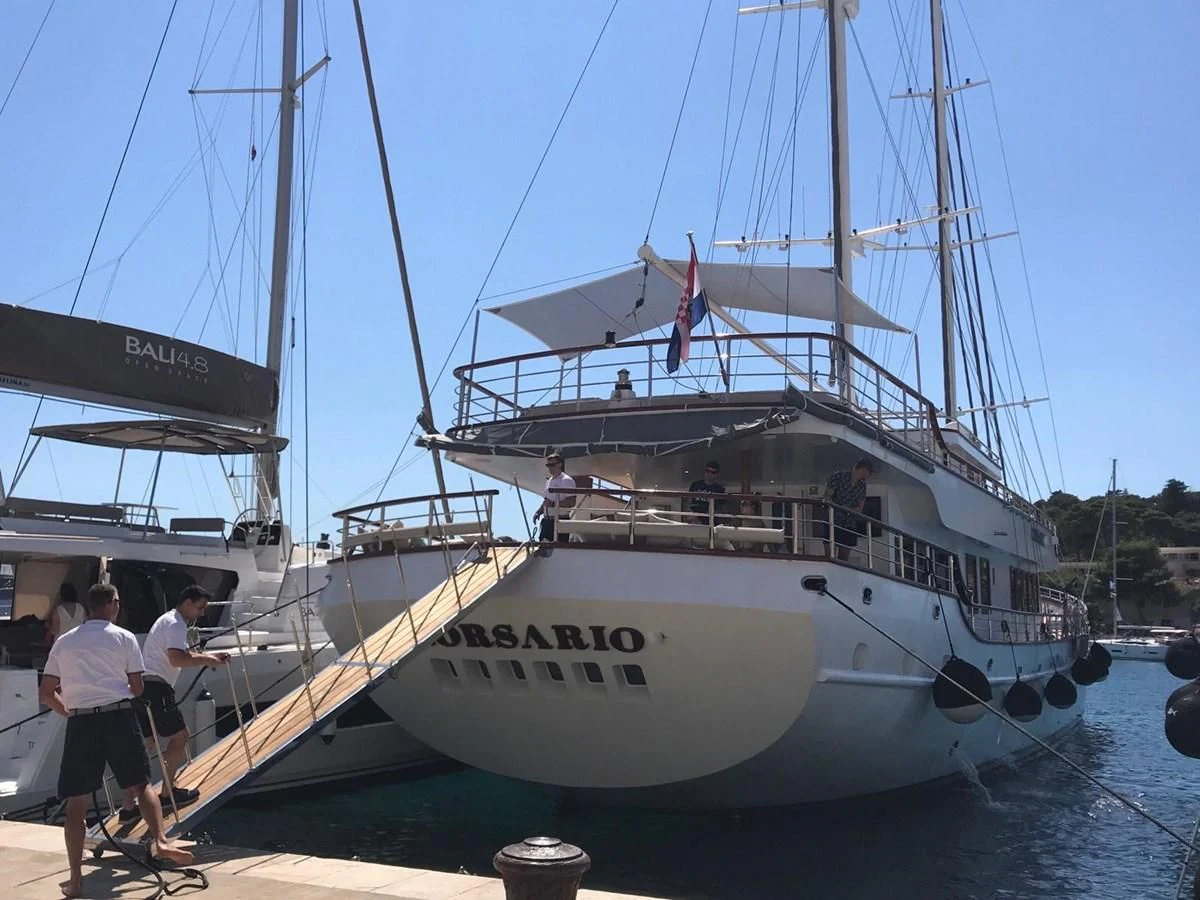 a boat docked at a pier aboard CORSARIO Yacht for Charter