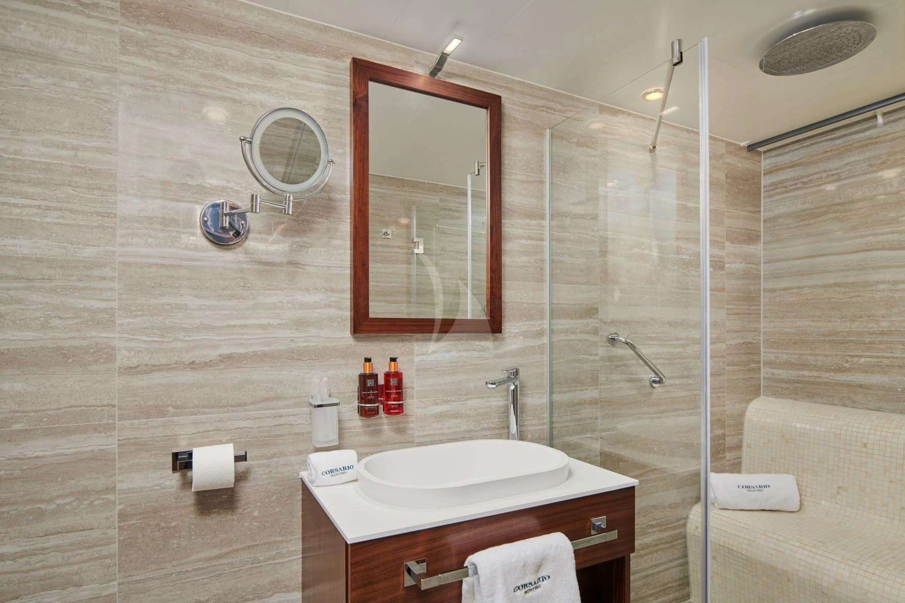 a bathroom with a glass shower aboard CORSARIO Yacht for Charter