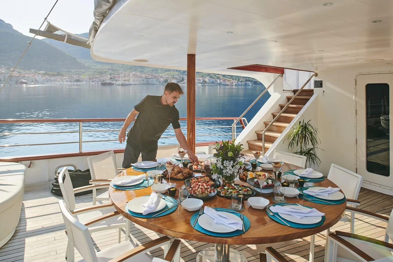 a person standing on a deck aboard CORSARIO Yacht for Charter