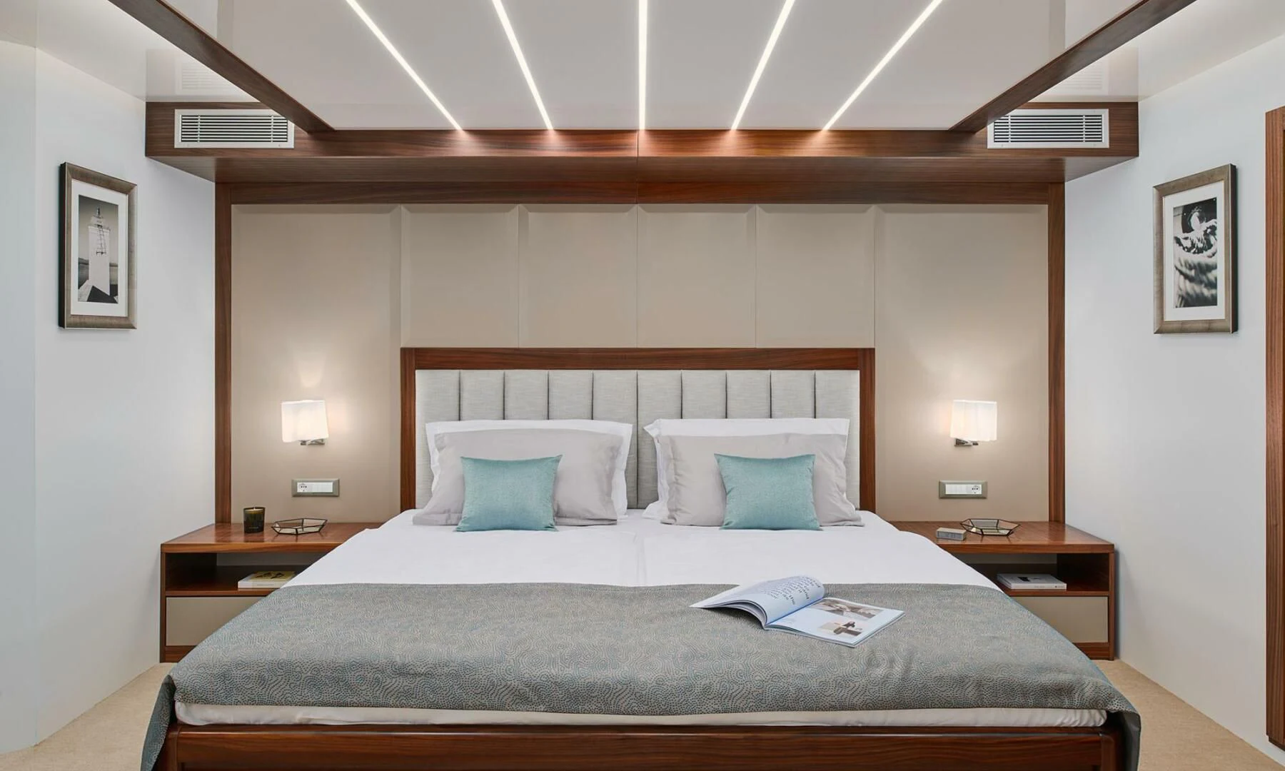 a bed with a large headboard aboard CORSARIO Yacht for Charter