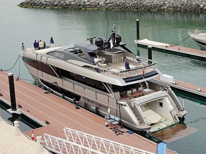 a large boat docked at a pier aboard AL ANBAR Yacht for Sale