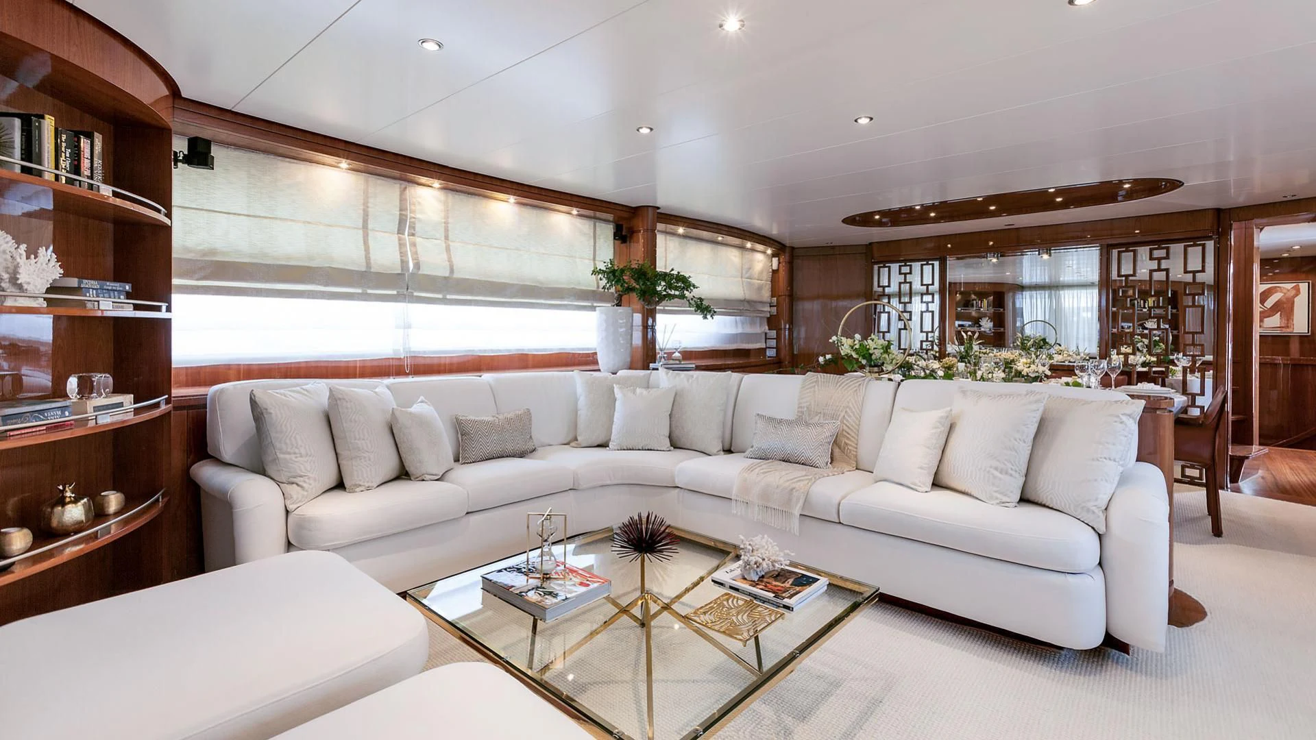 a living room with a white couch aboard ZEN Yacht for Sale