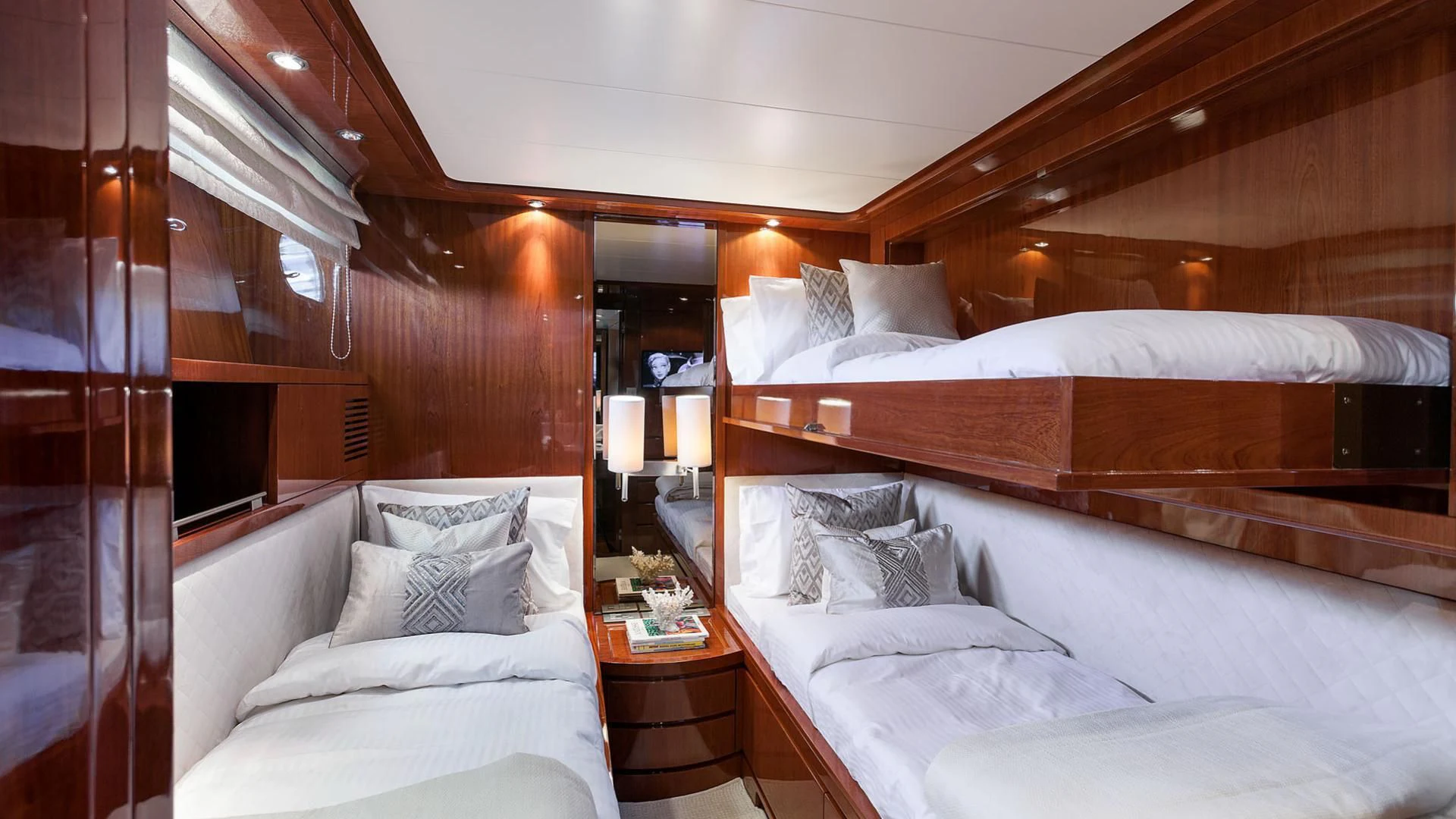 a room with a bed and a mirror aboard ZEN Yacht for Sale