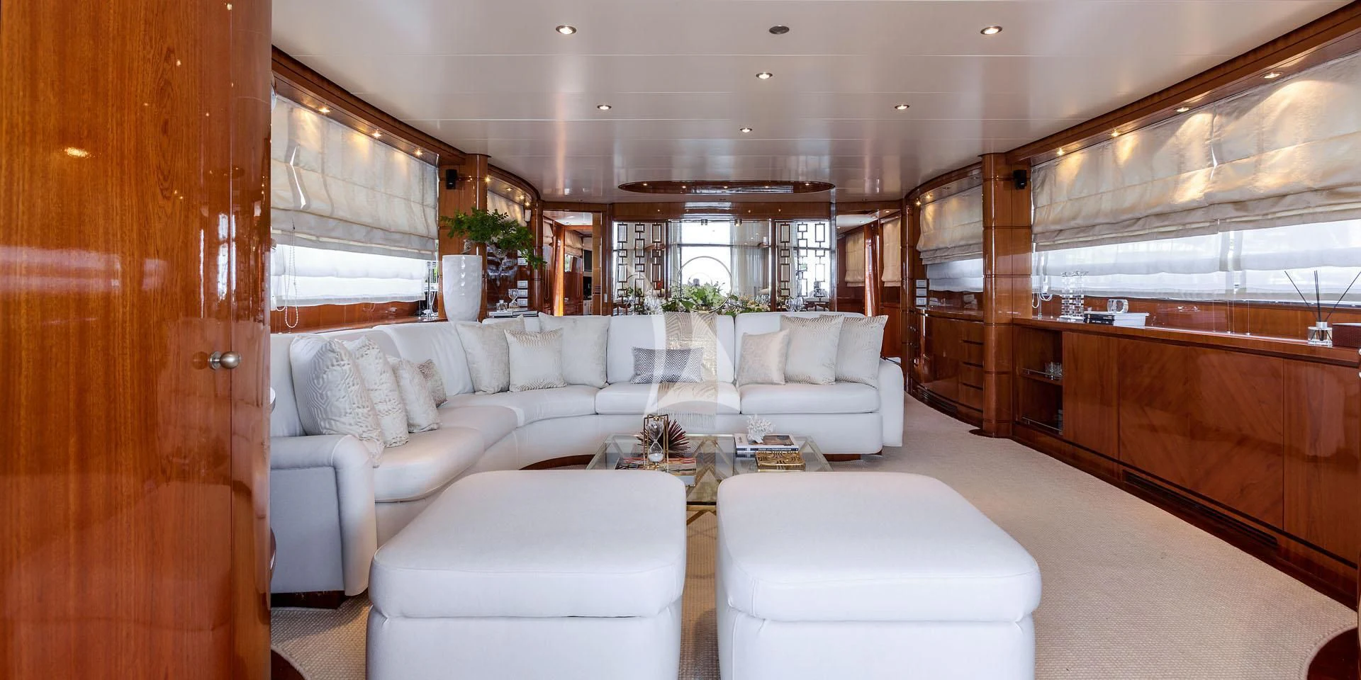 a living room with a white couch aboard ZEN Yacht for Sale