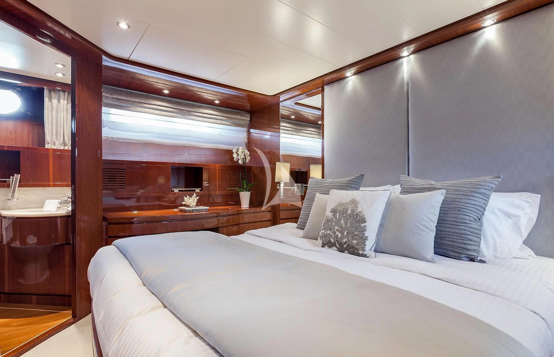 a bed with white sheets aboard ZEN Yacht for Sale