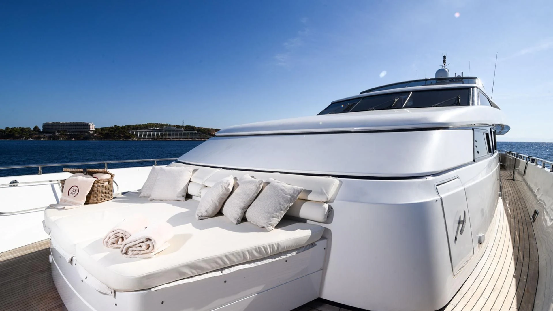 a white boat on a dock aboard ZEN Yacht for Sale