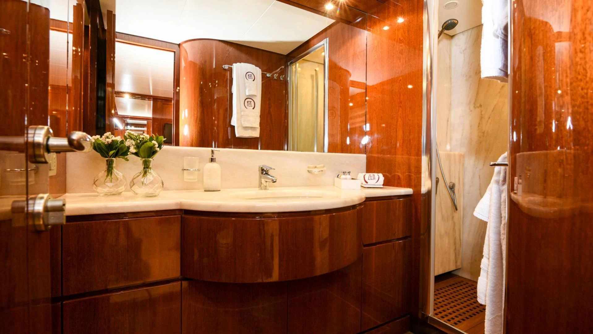 a bathroom with a large mirror aboard ZEN Yacht for Sale