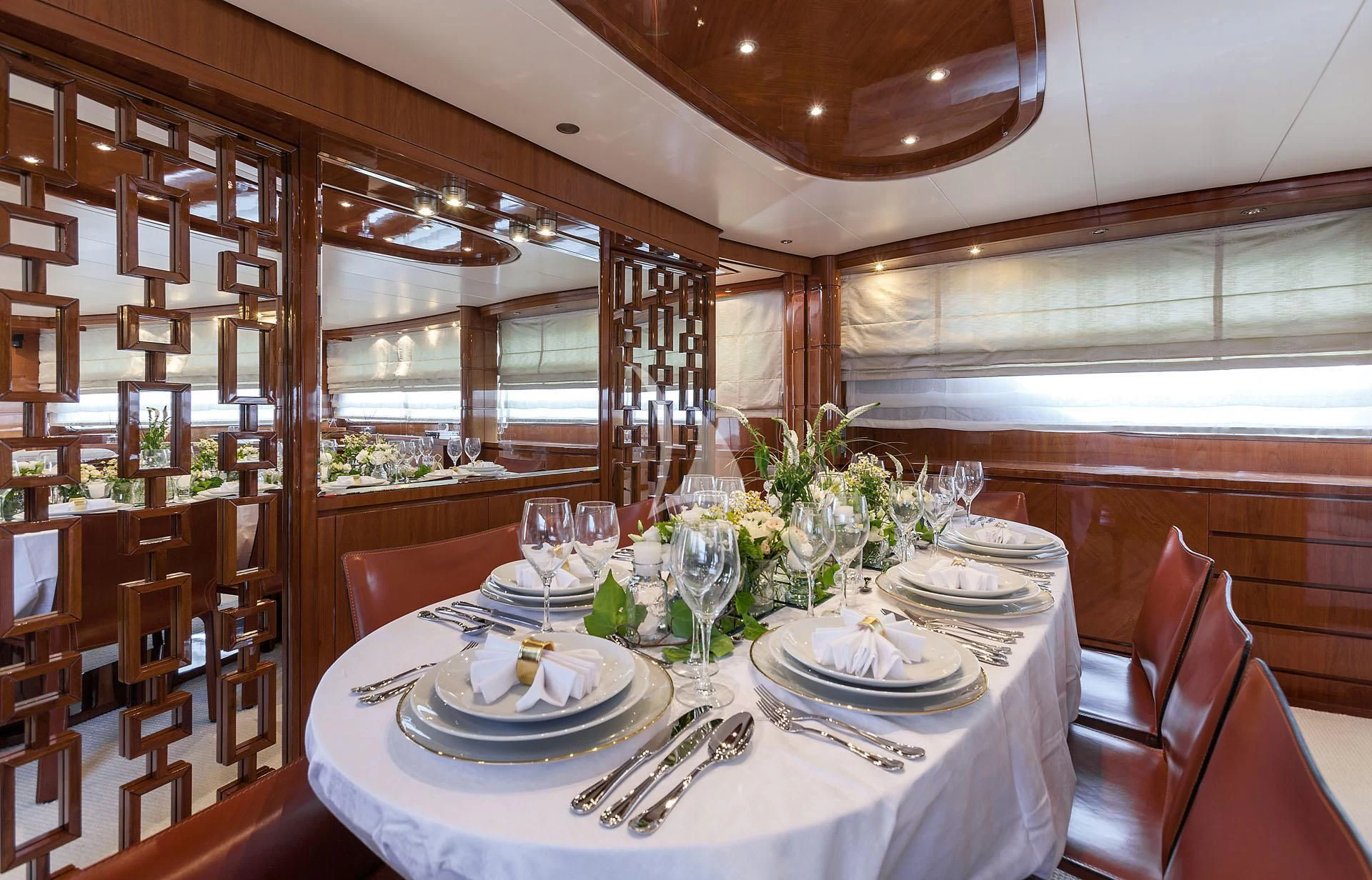 a dining room with a table set aboard ZEN Yacht for Sale