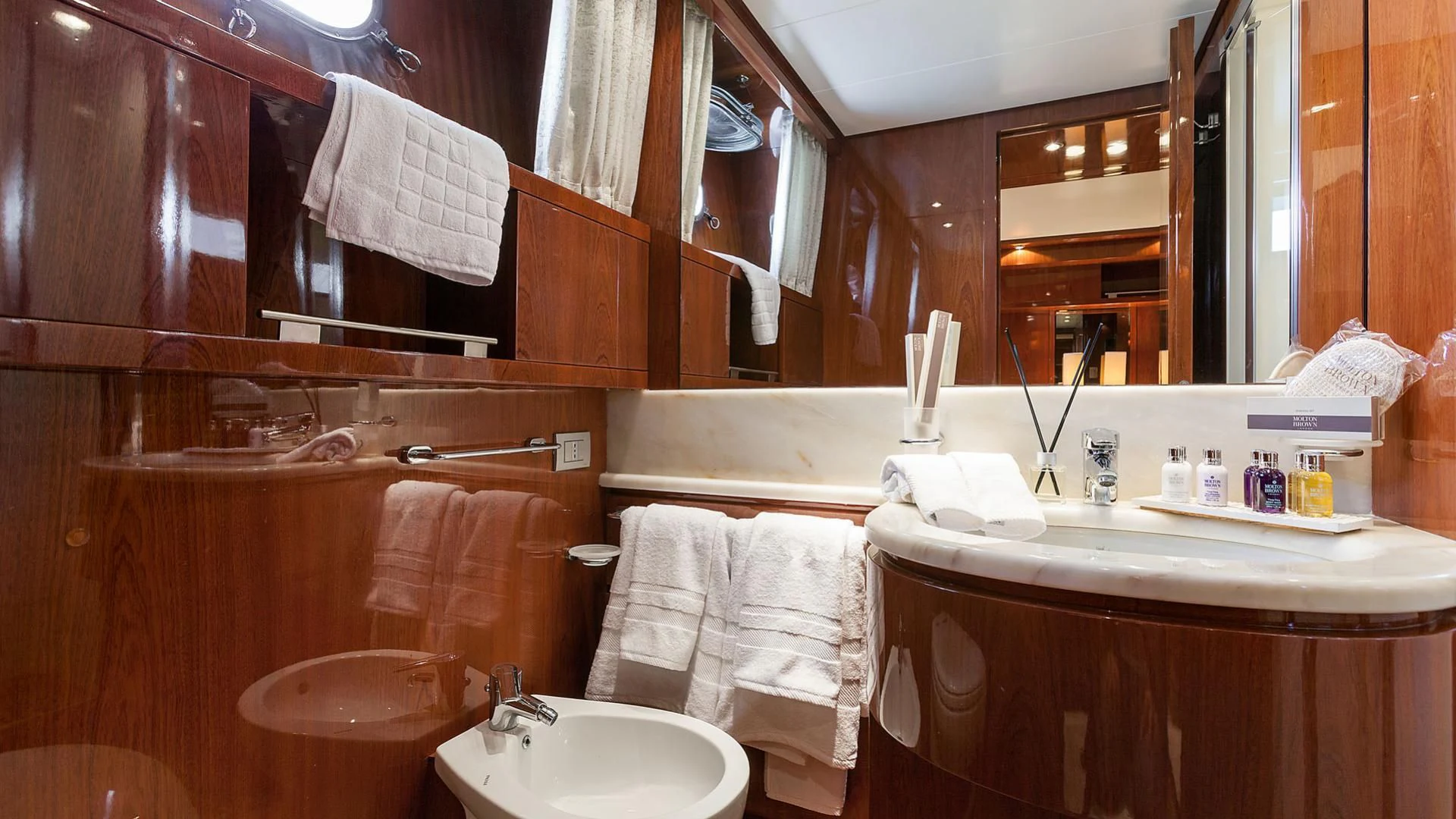 a bathroom with a sink and a mirror aboard ZEN Yacht for Sale
