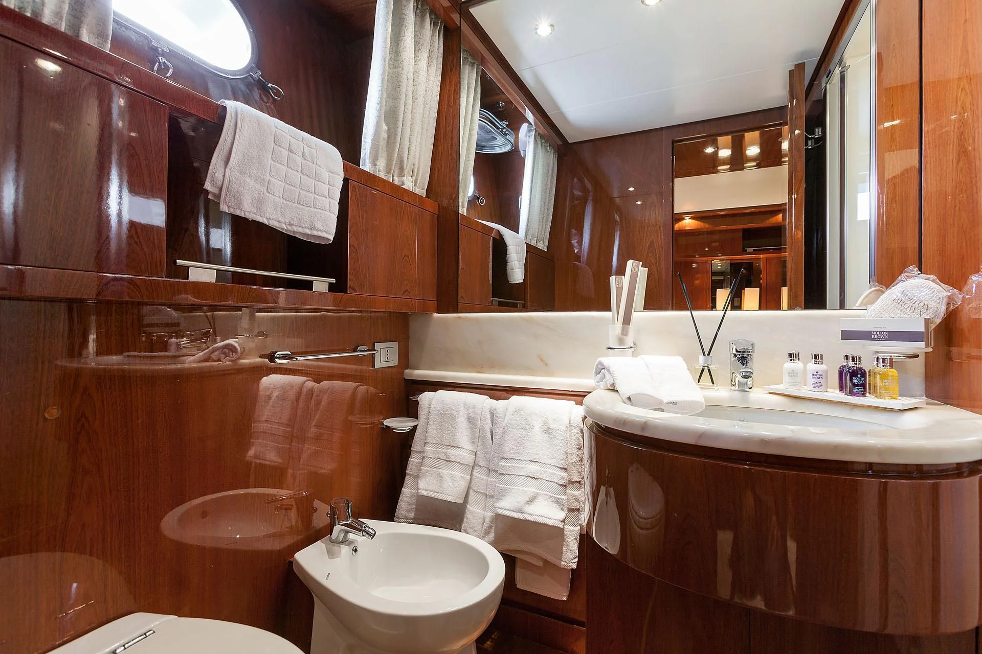 a bathroom with a sink and a mirror aboard ZEN Yacht for Sale