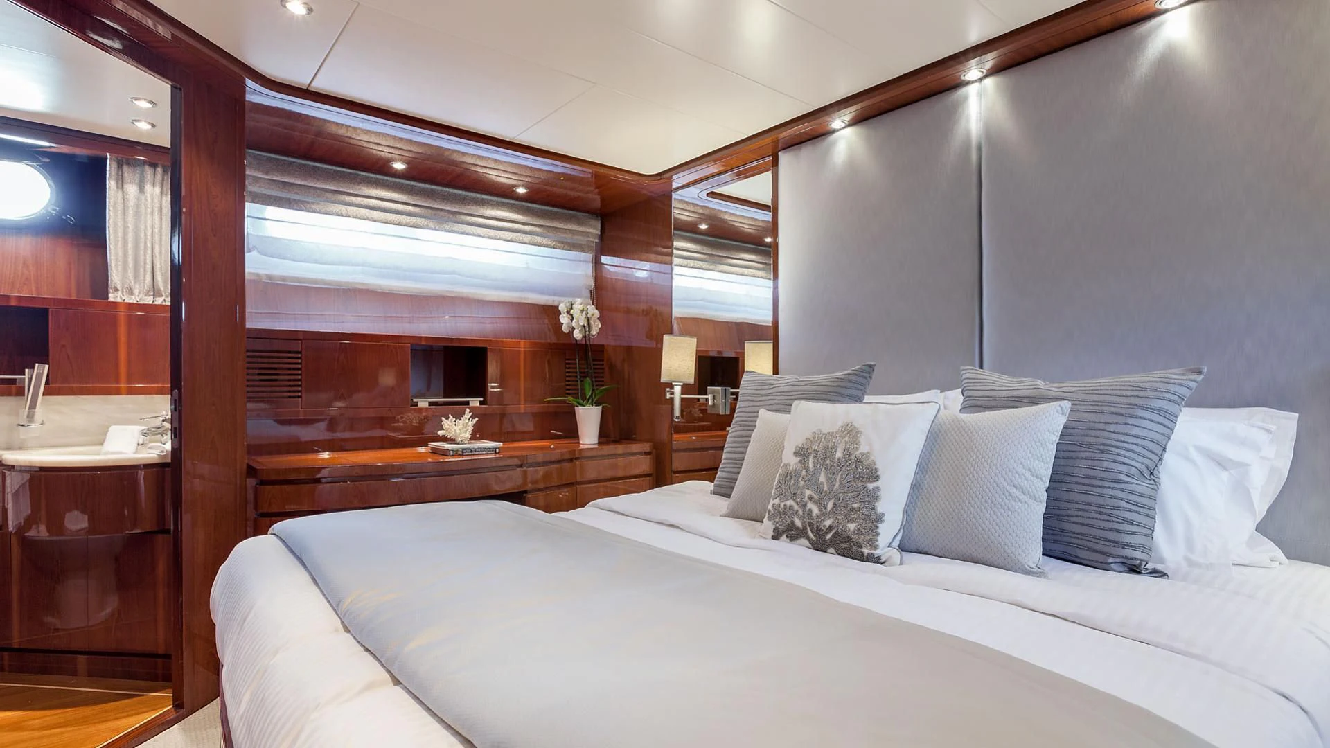 a bed with white sheets aboard ZEN Yacht for Sale