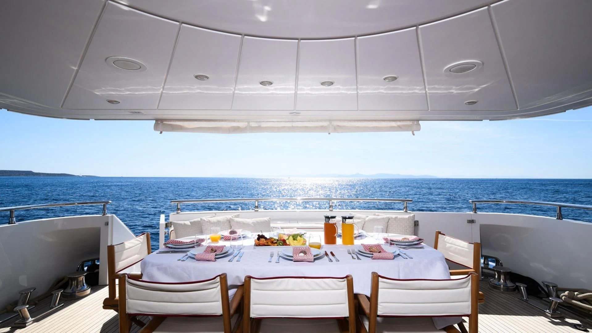 a table set for a meal on a boat aboard ZEN Yacht for Sale