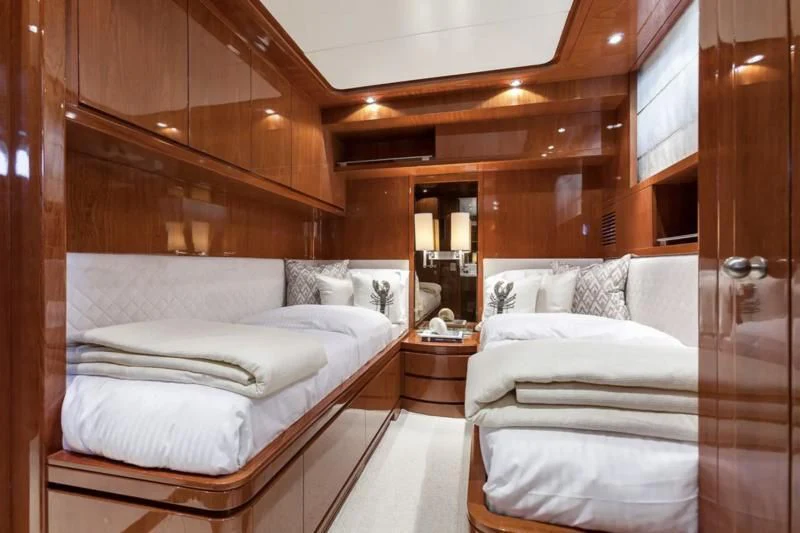a room with two beds aboard ZEN Yacht for Sale