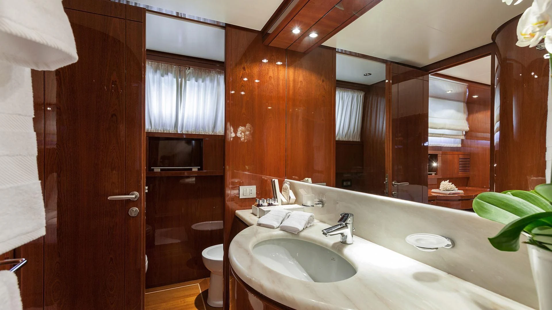a bathroom with a large mirror aboard ZEN Yacht for Sale