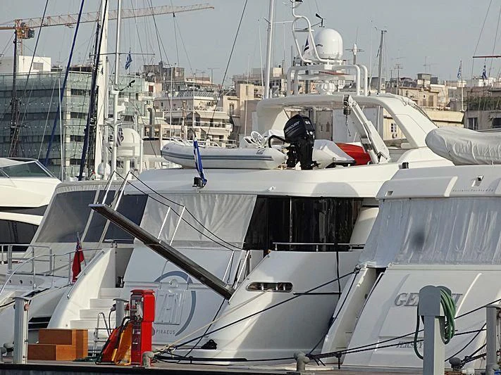 a boat with a person standing on the deck aboard ZEN Yacht for Sale