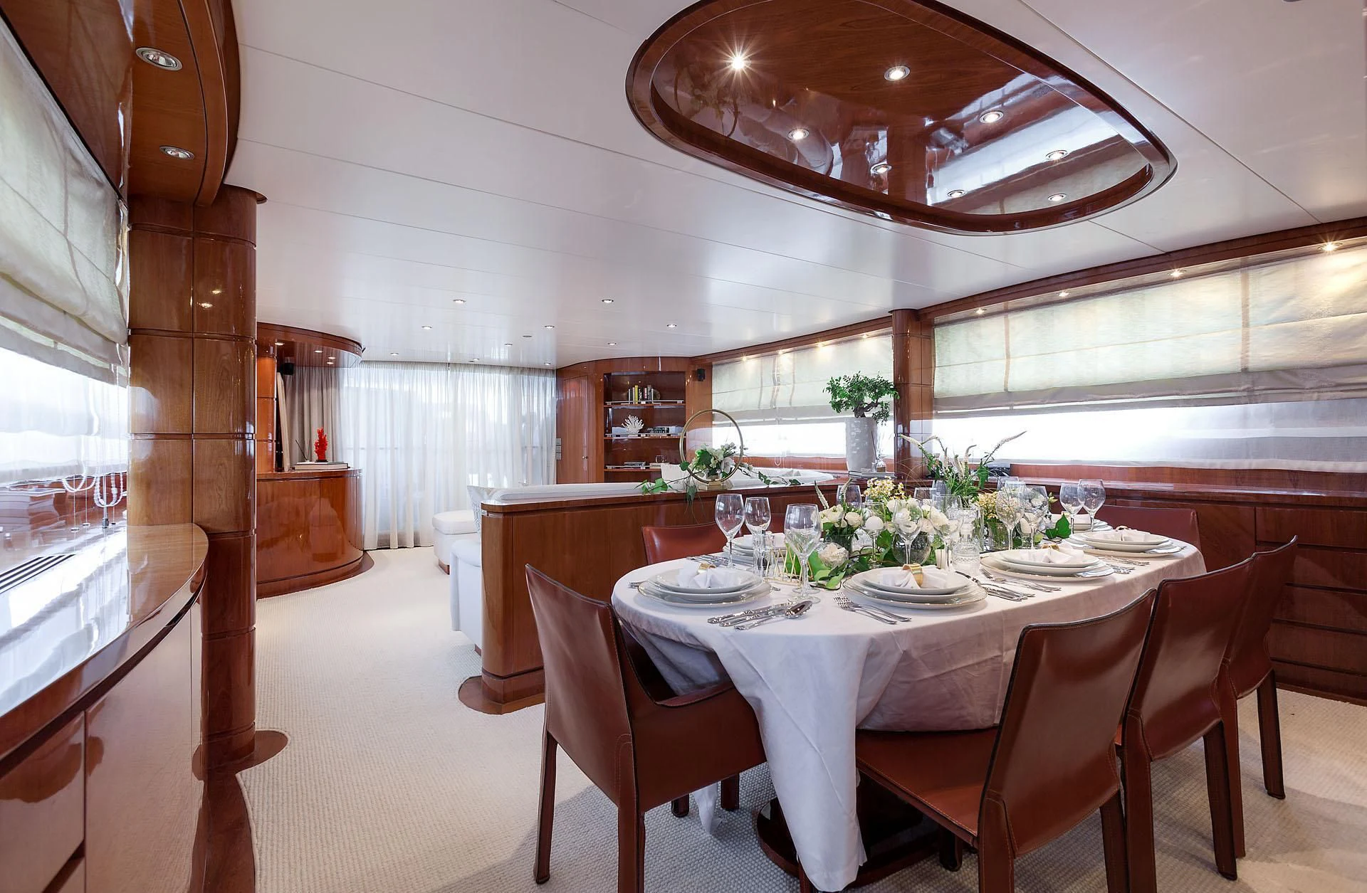 a dining room with a table and chairs aboard ZEN Yacht for Sale