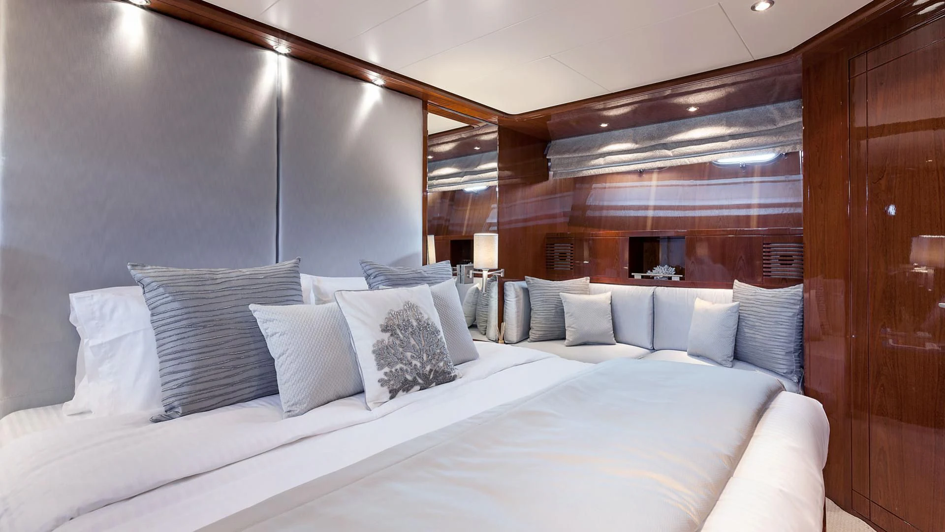 a bed with white pillows aboard ZEN Yacht for Sale