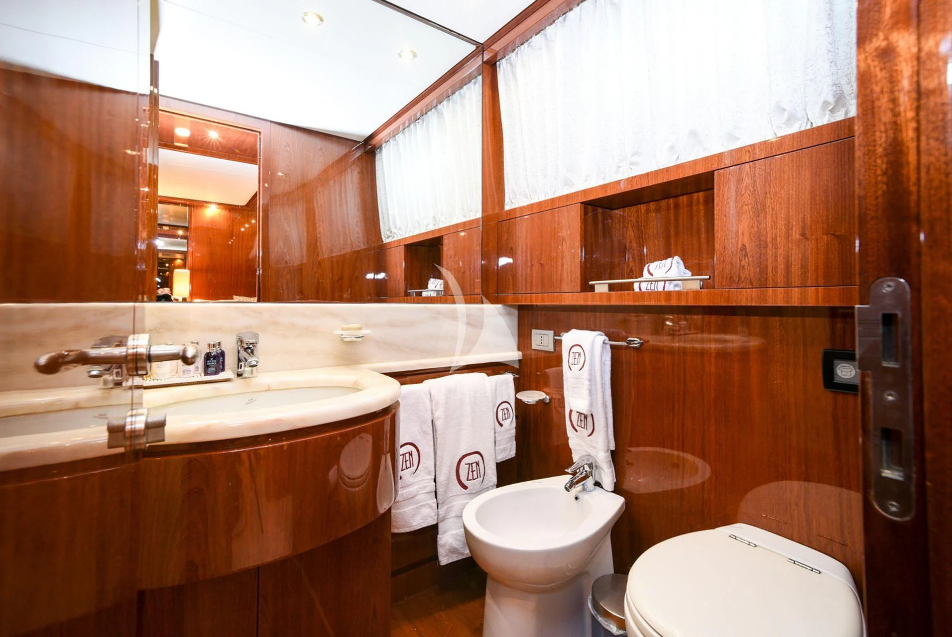 a bathroom with a sink toilet and a bathtub aboard ZEN Yacht for Sale