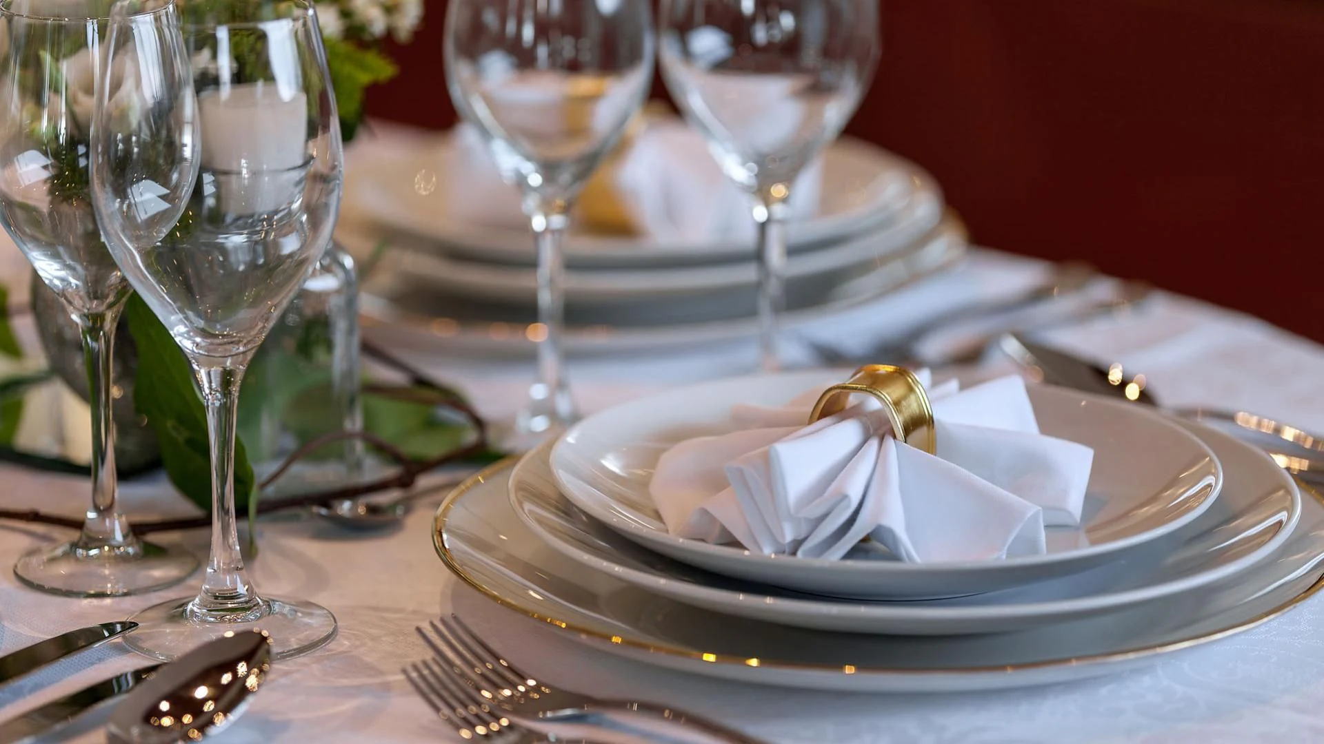 a plate of food and wine glasses aboard ZEN Yacht for Sale