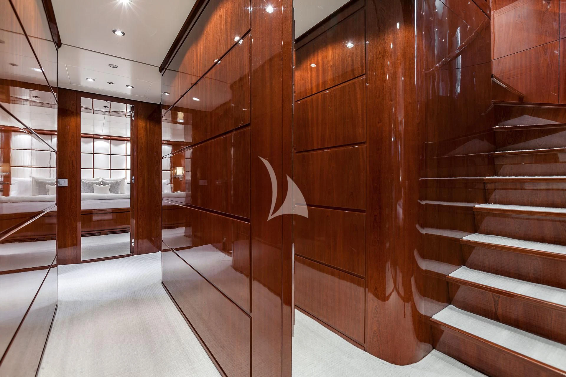 a room with wooden walls and a staircase aboard ZEN Yacht for Sale