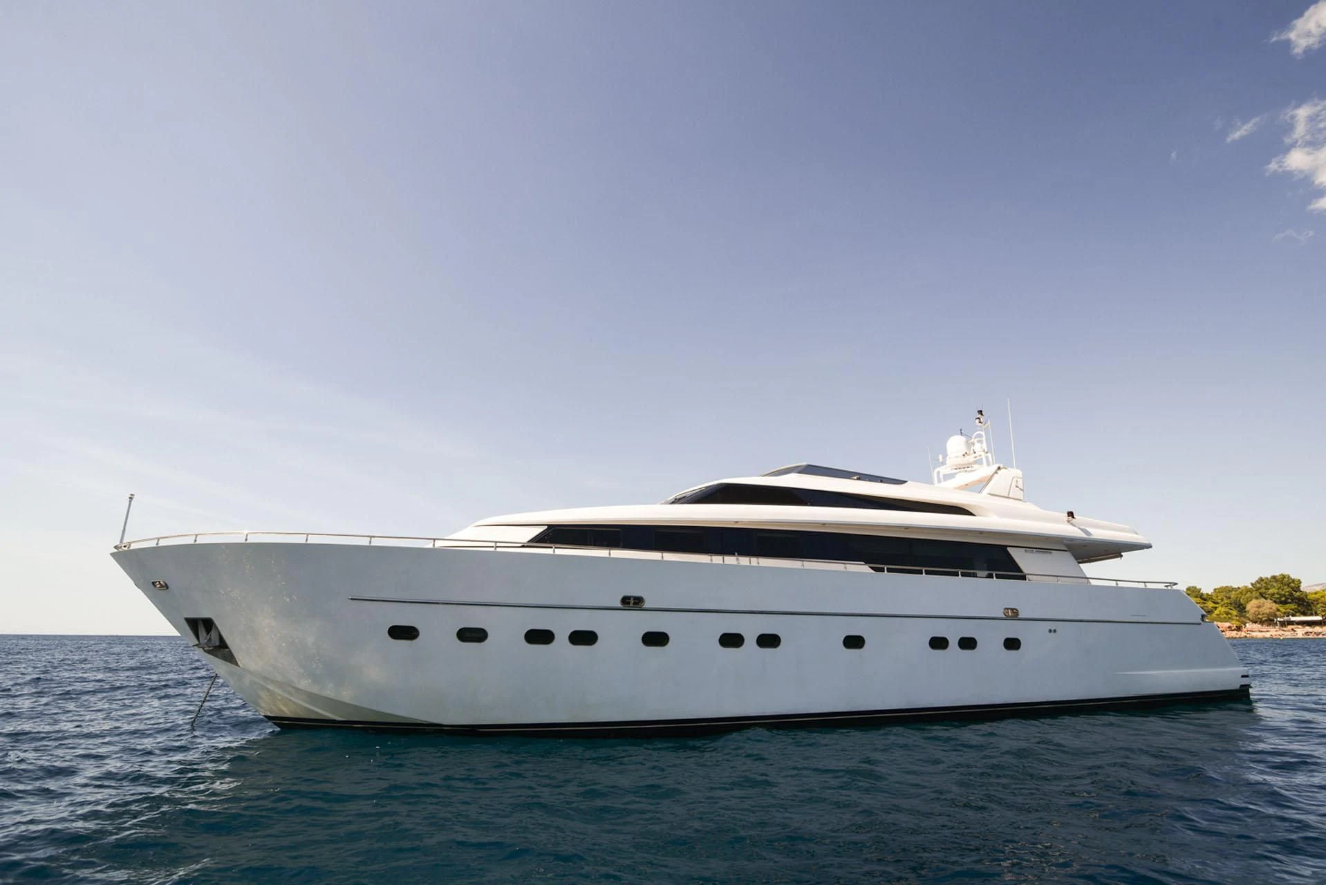 a white yacht in the water aboard ZEN Yacht for Sale