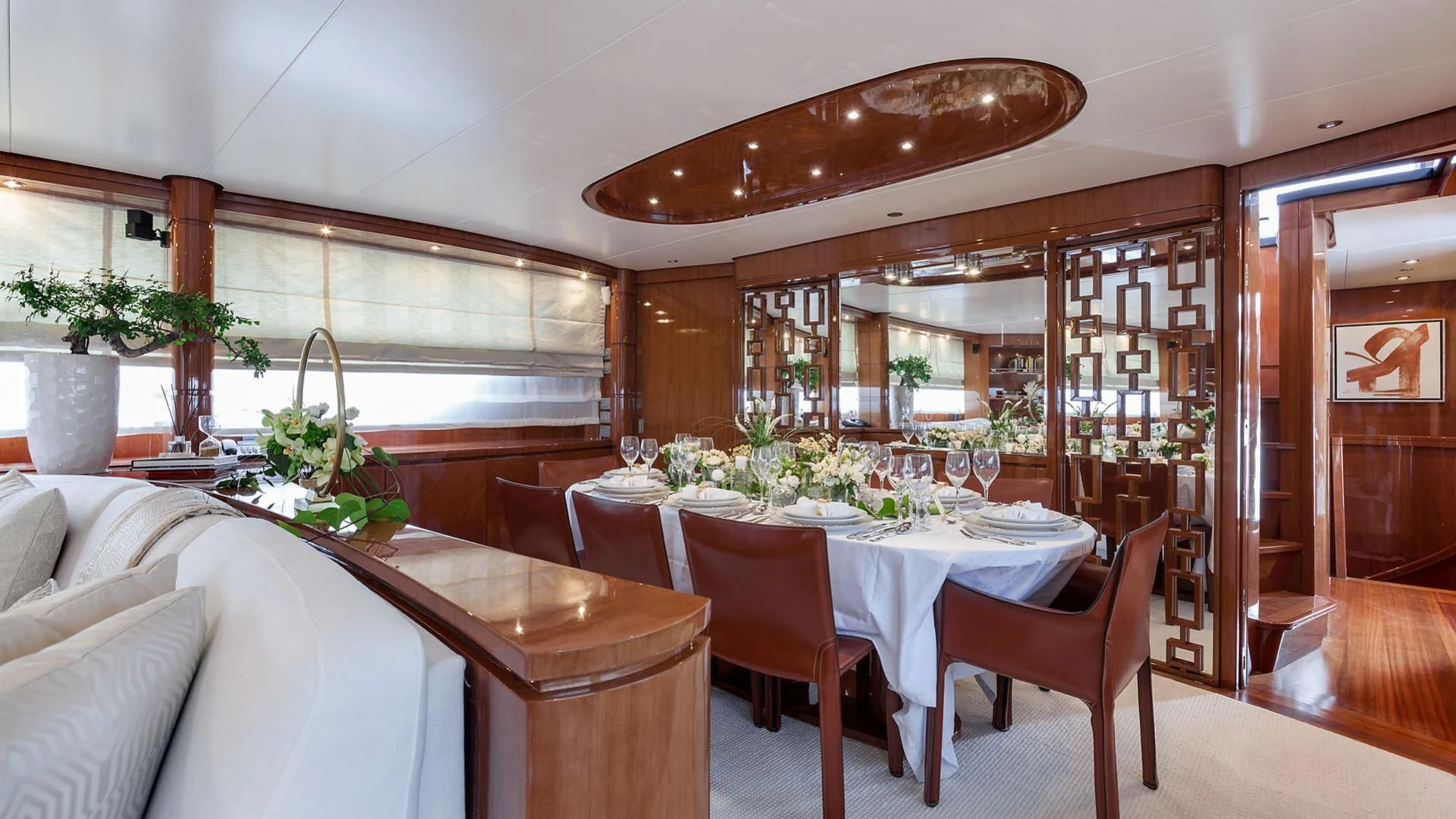a dining room with a table and chairs aboard ZEN Yacht for Sale