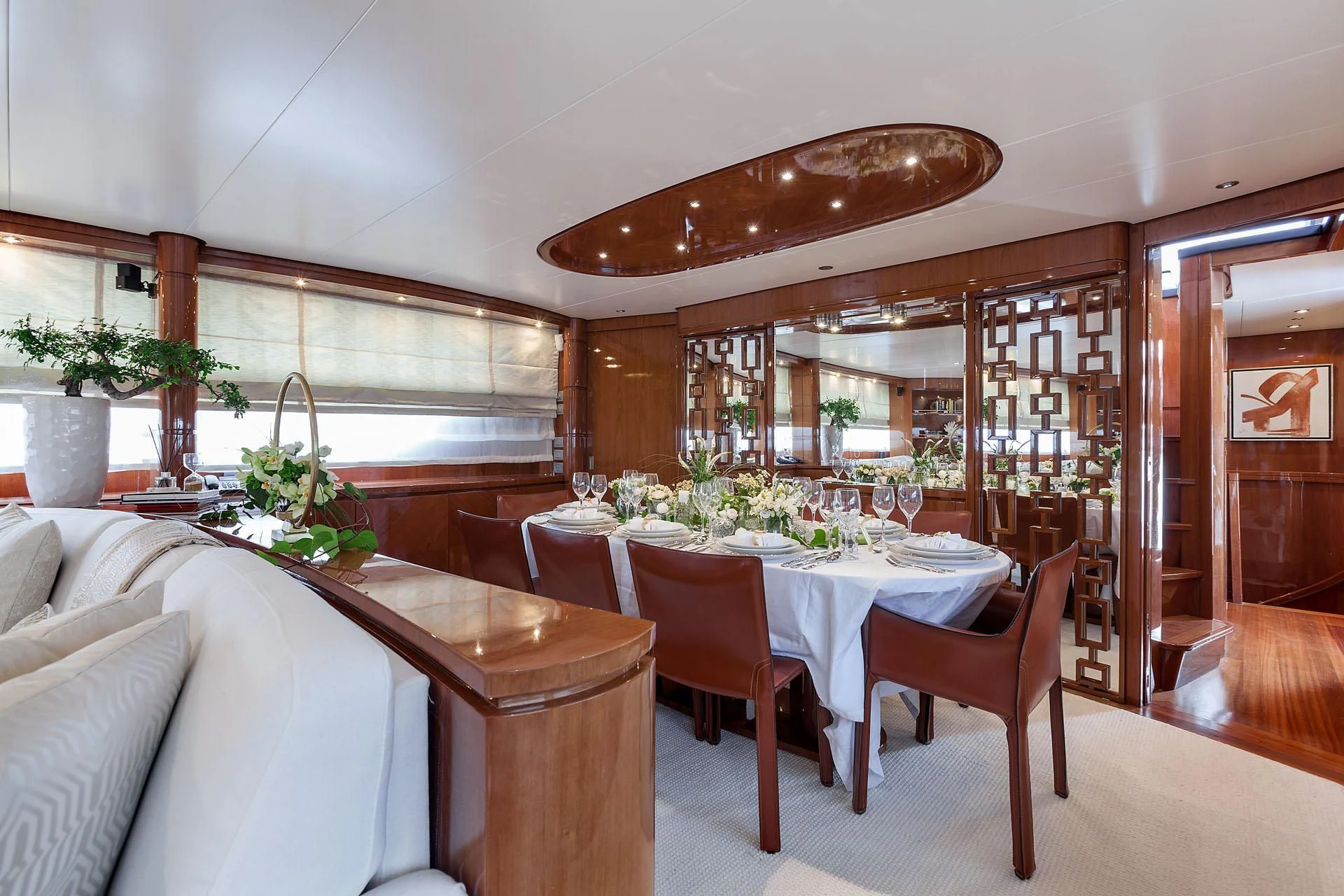 a dining room with a table and chairs aboard ZEN Yacht for Sale