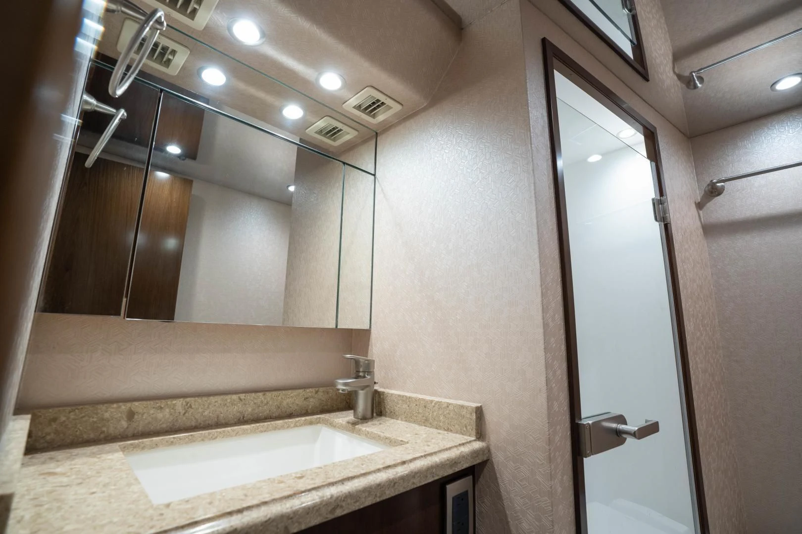 a bathroom with a large mirror aboard MER SEA SAKES Yacht for Sale