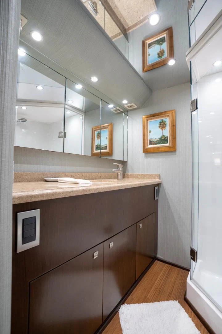 a bathroom with a countertop sink and mirror aboard MER SEA SAKES Yacht for Sale