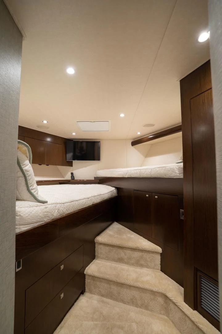 a room with a bed and a television aboard MER SEA SAKES Yacht for Sale