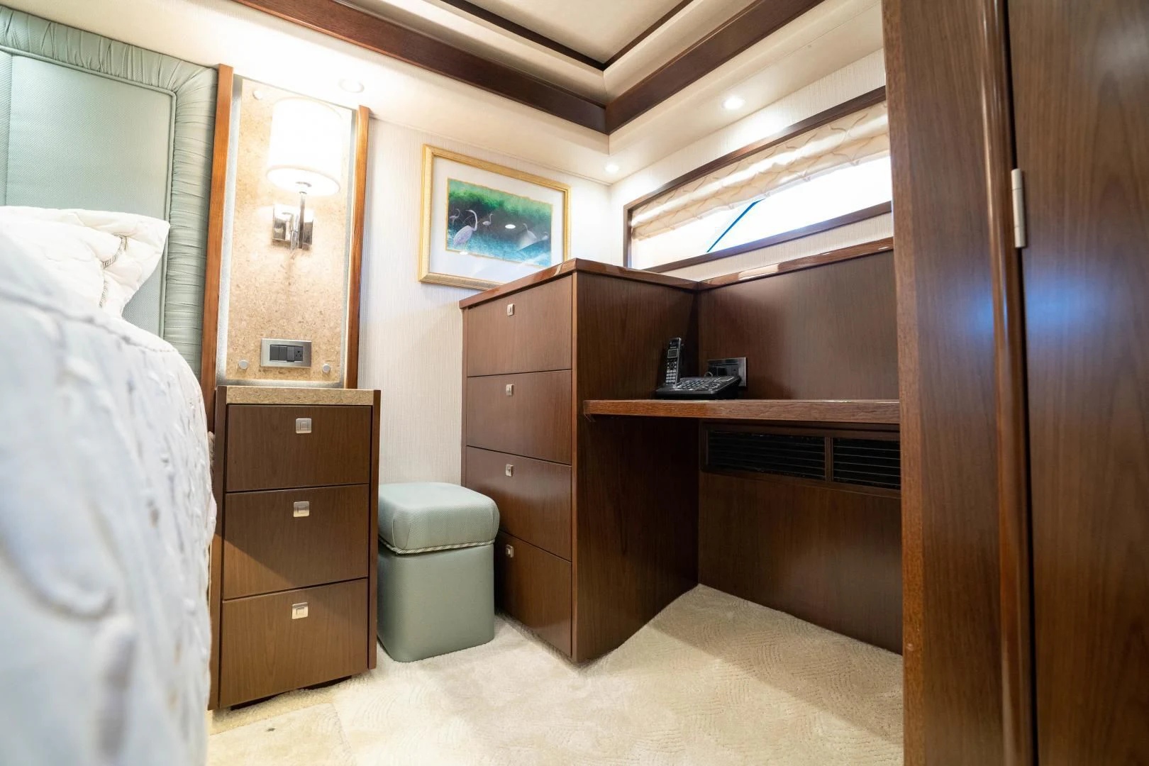 a bedroom with a bed and a dresser aboard MER SEA SAKES Yacht for Sale